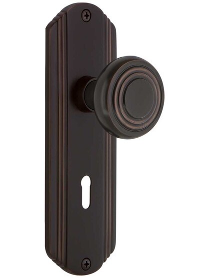 Streamline Moderne Mortise Lock Set with Matching Knobs with Keyhole in Timeless Bronze.